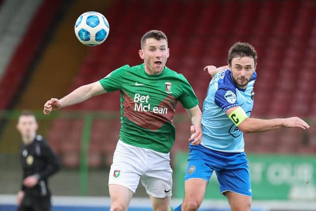 Francis McCaffrey in Premiership action for Warrenpoint Town against Glentoran's Bobby Burns in 2021. PIC: Desmond  Loughery/Pacemaker Press