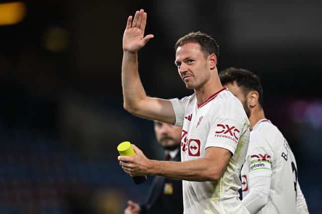 Jonny Evans waves to fans on the pitch after the English Premier League football match between Burnley and Manchester United at Turf Moor in Burnley. PIC: PAUL ELLIS/AFP via Getty Images