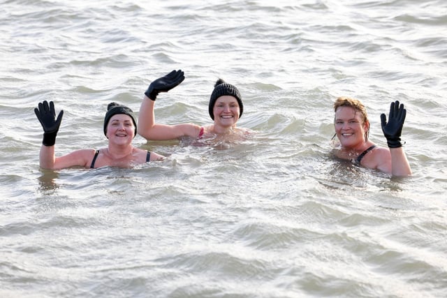 Braving the cold the at the annual New Year's Day swim in Carnlough, Co. Antrim.