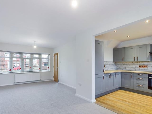 The kitchen leads conveniently into a large lounge/diner. Nearby is a downstairs toilet and a useful under-stairs storage cupboard.