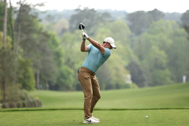 Rory McIlroy of Northern Ireland plays his shot from the 11th tee during the first round of the 2023 Masters Tournament at Augusta National Golf Club.