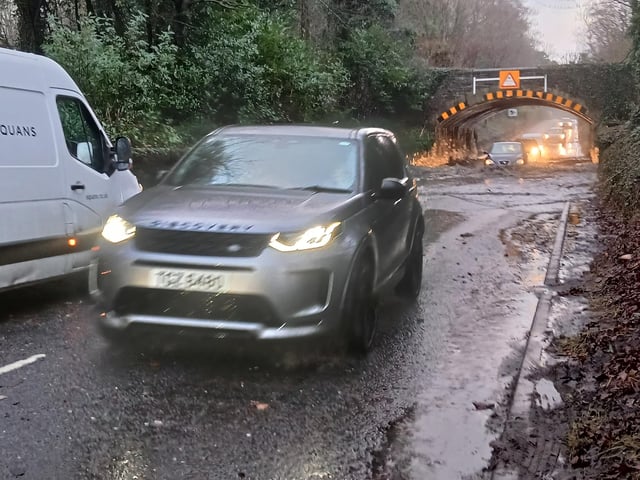 Plenty of larger cars confidently passed through the flooding on the Ballysallagh Road, which leads to the Craigantlet hills. Pic Ben Lowry Saturday January 17 2026