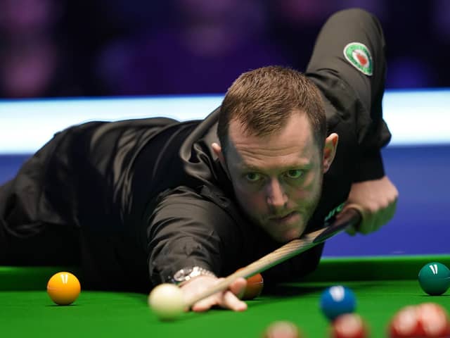 Mark Allen in action against John Higgins during day four of the MrQ Masters at Alexandra Palace, London.