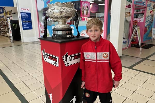 Ten-year-old Harvey Woods-Guy getting a closer look at the BetMcLean Cup in Portadown's Meadows Shopping Centre during a pre-final tour of the trophy. (Photo by National World)