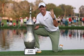 Rory McIlroy poses with the trophy after a record fourth victory in the Hero Dubai Desert Classic at Emirates Golf Club