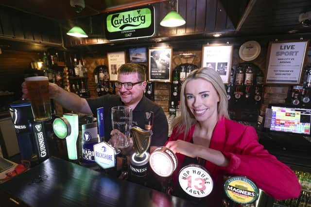 Tourism NI’s Make it Here campaign is currently helping employers in the sector shine a light on the positive aspects of careers in the field, and tackling some of the outdated
misperceptions that working in tourism and hospitality means long hours for low pay. Pictured is Una Burns, manager of Charlie’s Bar in Enniskillen and a bar staff member