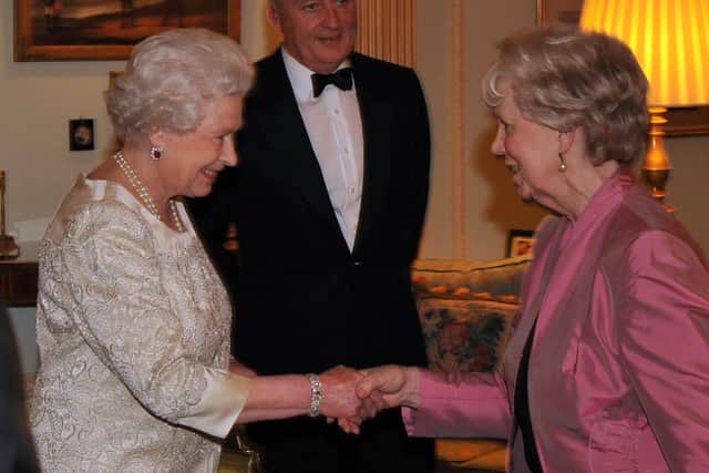 Queen Elizabeth II meets Lord Lieutenant for County Antrim, Joan Christie, with Secretary of State for Northern Ireland Shaun Woodward at a dinner for the Lord Lieutenants of Northern Ireland at Hillsborough Castle.