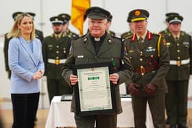 Minister for Defence Helen McEntee and Chief of Staff, Lieutenant General Rossa Mulcahy with Father Paul Murphy (centre) being presented with the Distinguished Service Medal, with Merit, at Dun Ui Mhaoiliosa in Renmore Barracks, Co Galway, in recognition of action taken during a knife attack at Renmore Barracks in August 2024. Picture: Brian Lawless/PA Wire