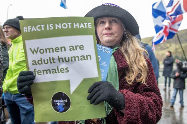 A campaigner outside the Scottish Parliament at Holyrood in Edinburgh, to mark the introduction of the Hate Crime and Public Order (Scotland) Act. One of the things the act does is make it illegal to 'stir up hatred' against people who say they are transgender