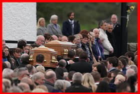 The coffins of James Monaghan and his mother Catherine O'Donnell are carried into St Michael's Church, Creeslough for their funeral mass.