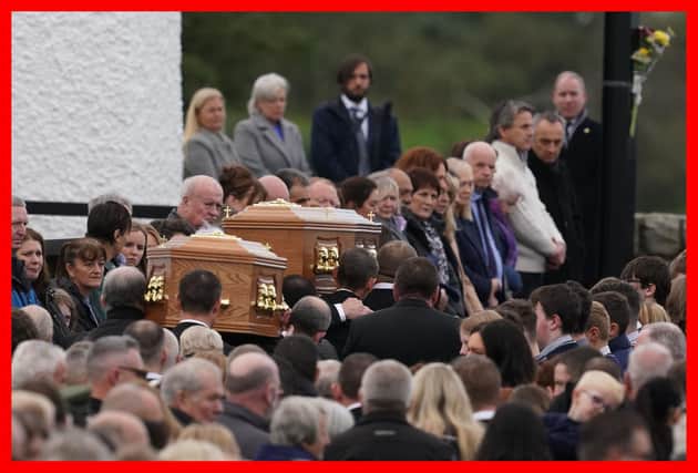 The coffins of James Monaghan and his mother Catherine O'Donnell are carried into St Michael's Church, Creeslough for their funeral mass.