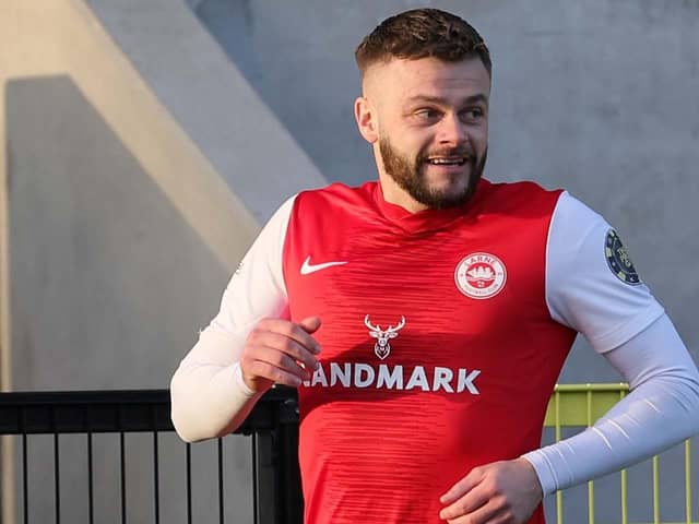 Larne striker Andy Ryan was hit by an object that appeared to be thrown from the crowd in the County Antrim Shield Final