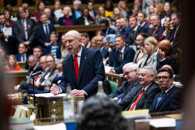 Chancellor of the Exchequer John Healey delivering his budget in the House of Commons, Westminster.