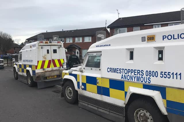 A PSNI arrest operation targeting suspected paramilitaries in Belfast. Photo: Pacemaker
