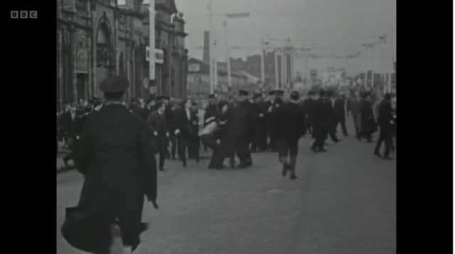 Screengrab from the April 2023 BBC documentary series The House of Paisley. This scene shows trouble in East Bridge Street, on the edge of the Markets. It seems to have been filmed after Rev Paisley marched past. Rev Foster says a riot in Cromac Square was under way before the marchers ever left Ravenhill Free Presbyterian Church