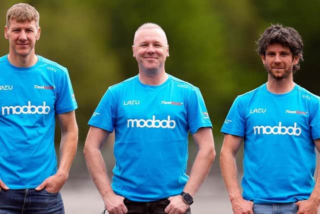 MLav Racing team owner Michael Laverty (centre) with Ian Hutchinson (left) and Mike Browne. (Photo by Isle of Man TT)