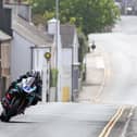 Michael Dunlop powers through Kirk Michael village on his Yamaha R6 during qualifying at the Isle of Man TT