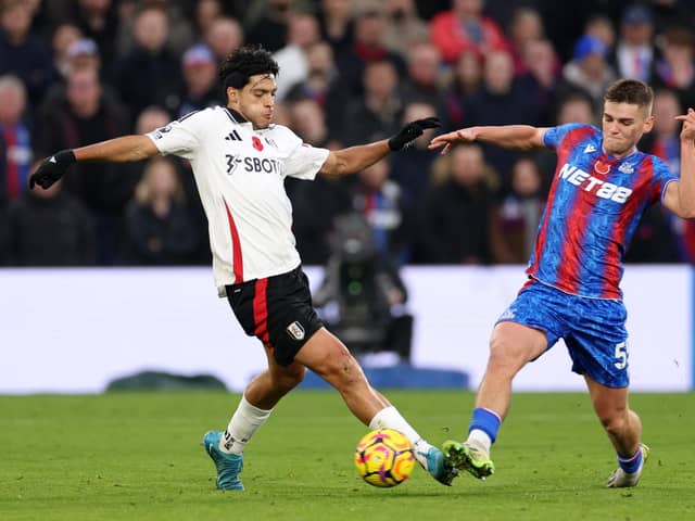 LONDON, ENGLAND - NOVEMBER 09: Raul Jimenez of Fulham battles for possession with Justin Devenny of Crystal Palace during the Premier League match between Crystal Palace FC and Fulham FC at Selhurst Park on November 09, 2024 in London, England. (Photo by Warren Little/Getty Images)