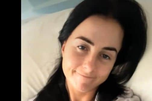 A screen shot of Lisa McHugh unwell in hospital