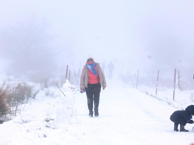 Snow fall on Divis and Black Mountain, West Belfast.Members of the public pictured on Divis Mountain on the outskirts of west Belfast.Picture by Jonathan Porter/PressEye