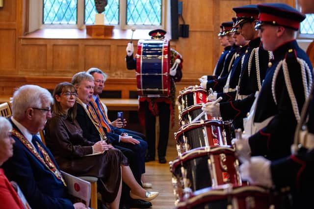 Guests get an up-close view of a drumming demonstration at the Queen’s University event. Photo by Graham Baalham-Curry