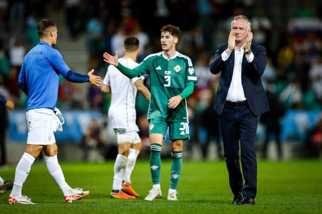Northern Ireland manager Michael O'Neill applauds the travelling fans following defeat against Slovenia