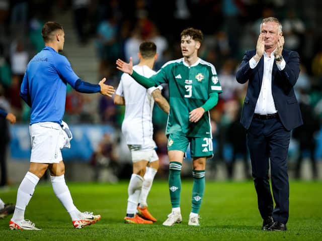 Northern Ireland manager Michael O'Neill applauds the travelling fans following defeat against Slovenia
