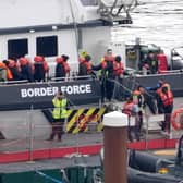 A group of people thought to be migrants are brought in to Dover, Kent