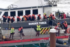 A group of people thought to be migrants are brought in to Dover, Kent