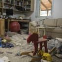 A baby rocking chair is left in a house that was destroyed in a battle between Israeli soldiers and Palestinian militants in Be'eri, Israel