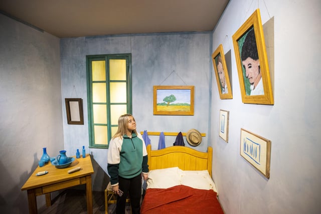 Evvie Bishop looks at Van Gogh's Bedroom at Van Gogh: The Immersive Experience exhibition at Carlisle Memorial Church in Belfast