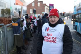 Mental health nurse Michael Rooney joins members of the Royal College of Nursing (RCN) on the picket line outside Belfast City Hospital in Belfast