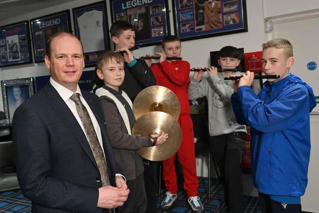 Communities Minister Gordon Lyons meets young people in Carrickfergus who have benefitted from the Musical Instruments Scheme funded by the Department for Communities.