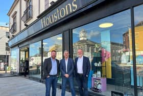 Two family-owned Northern Ireland department stores have joined forces to offer over 175 years of business experience. Pictured are Philip and Stephen McCammon of Menarys with John Houston. Credit: Menarys
