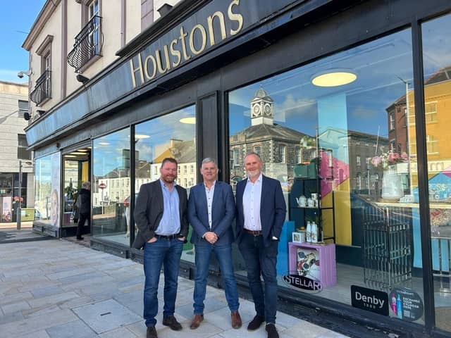 Two family-owned Northern Ireland department stores have joined forces to offer over 175 years of business experience. Pictured are Philip and Stephen McCammon of Menarys with John Houston. Credit: Menarys