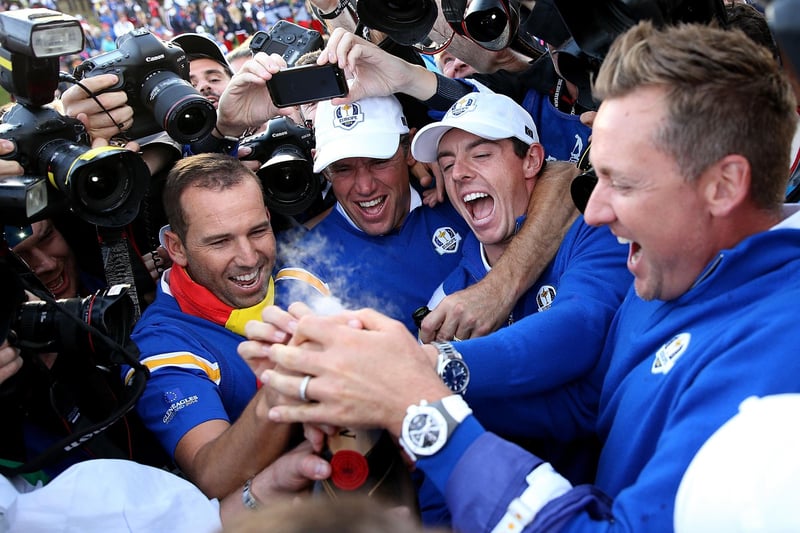 Rory McIlroy with, from left, Sergio Garcia, Lee Westwood and Ian Poulter celebrate winning the Ryder Cup in Scotland. (Photo by Ross Kinnaird/Getty Images)