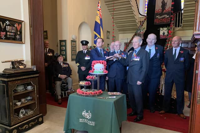 David Johnston, Northern Ireland Veterans' Commissioner, Colonel Salisbury and Lord Brookeborough cut the cake at the Poppy Appeal launch