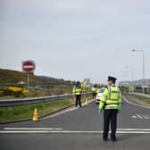 A Garda officer mans a checkpoint on the border between the Republic of Ireland and Northern Ireland in 2020