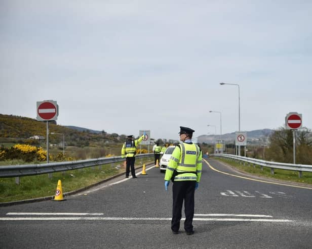 A Garda officer mans a checkpoint on the border between the Republic of Ireland and Northern Ireland in 2020