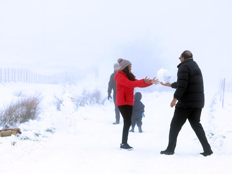 Snow fall on Divis and Black Mountain, West Belfast.Members of the public pictured on Divis Mountain on the outskirts of west Belfast.Picture by Jonathan Porter/PressEye