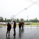Workers on site at Boucher Playing Fields in August 2024, ahead of gigs headlined by Liam Gallagher and Noah Kahan; councillor Jim Rodgers has said that the plans to build pitches on the site are fundamentally flawed due to space