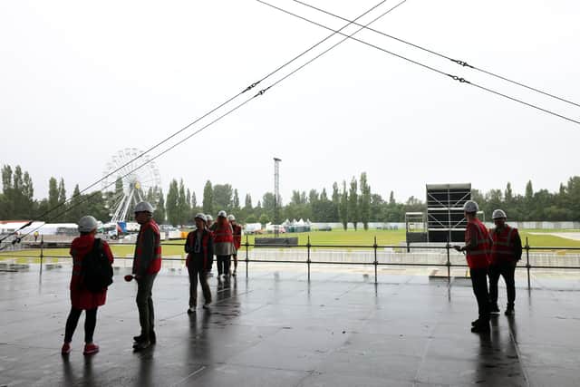 Workers on site at Boucher Playing Fields in August 2024, ahead of gigs headlined by Liam Gallagher and Noah Kahan; councillor Jim Rodgers has said that the plans to build pitches on the site are fundamentally flawed due to space