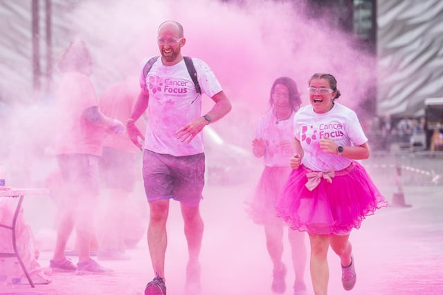 Hundreds of runners covered themselves head-to-toe in powder for Cancer Focus NI’s famous annual Pink Run