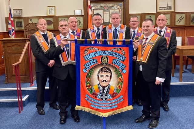 WM LOL871 Bro Graeme Stenhouse and officers of LOL 871 presenting a new district bannerette in remembrance of PDM Bro John Olphert to District Master Bro Kyle Thompson (DCGM).