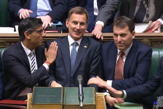 Prime Minister Rishi Sunak congratulates Chancellor of the Exchequer Jeremy Hunt after he delivered his autumn statement to MPs in the House of Commons, London. Picture date: Thursday November 17, 2022.
