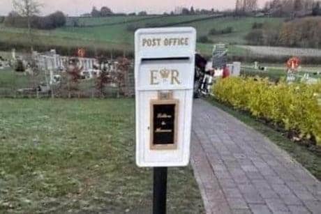 A postbox to heaven installed in a graveyard in England