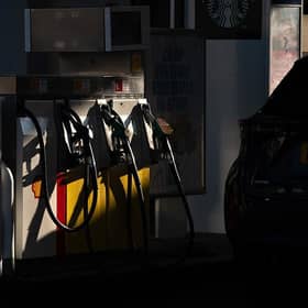 A customer arrives to re-fuel his car at a petrol station as fuel prices dip slightly in NI (photo by Bryn Colton/Getty Images)