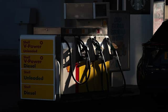 A customer arrives to re-fuel his car at a petrol station as fuel prices dip slightly in NI (photo by Bryn Colton/Getty Images)