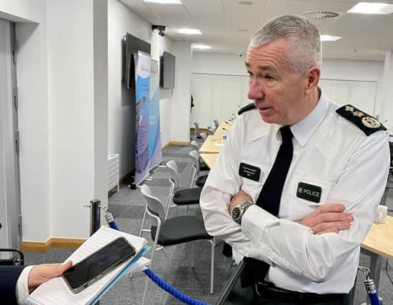 PSNI Chief Constable Jon Boutcher speaks to the media after a meeting of the Policing Board in Belfast