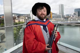 Actor James Martin with his honorary doctorate from Ulster University